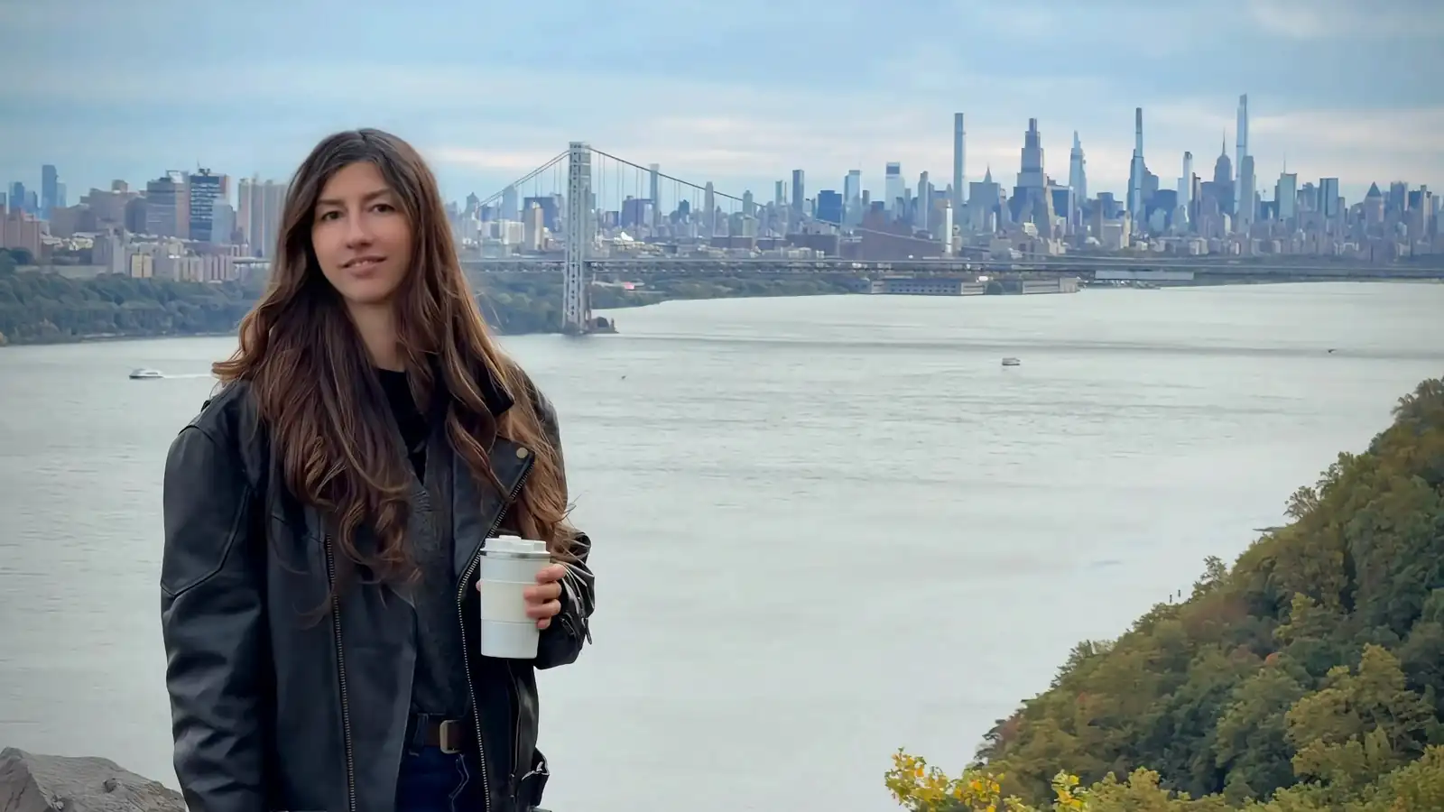 Kateryna Besedina with the Hudson River and Manhattan behind her